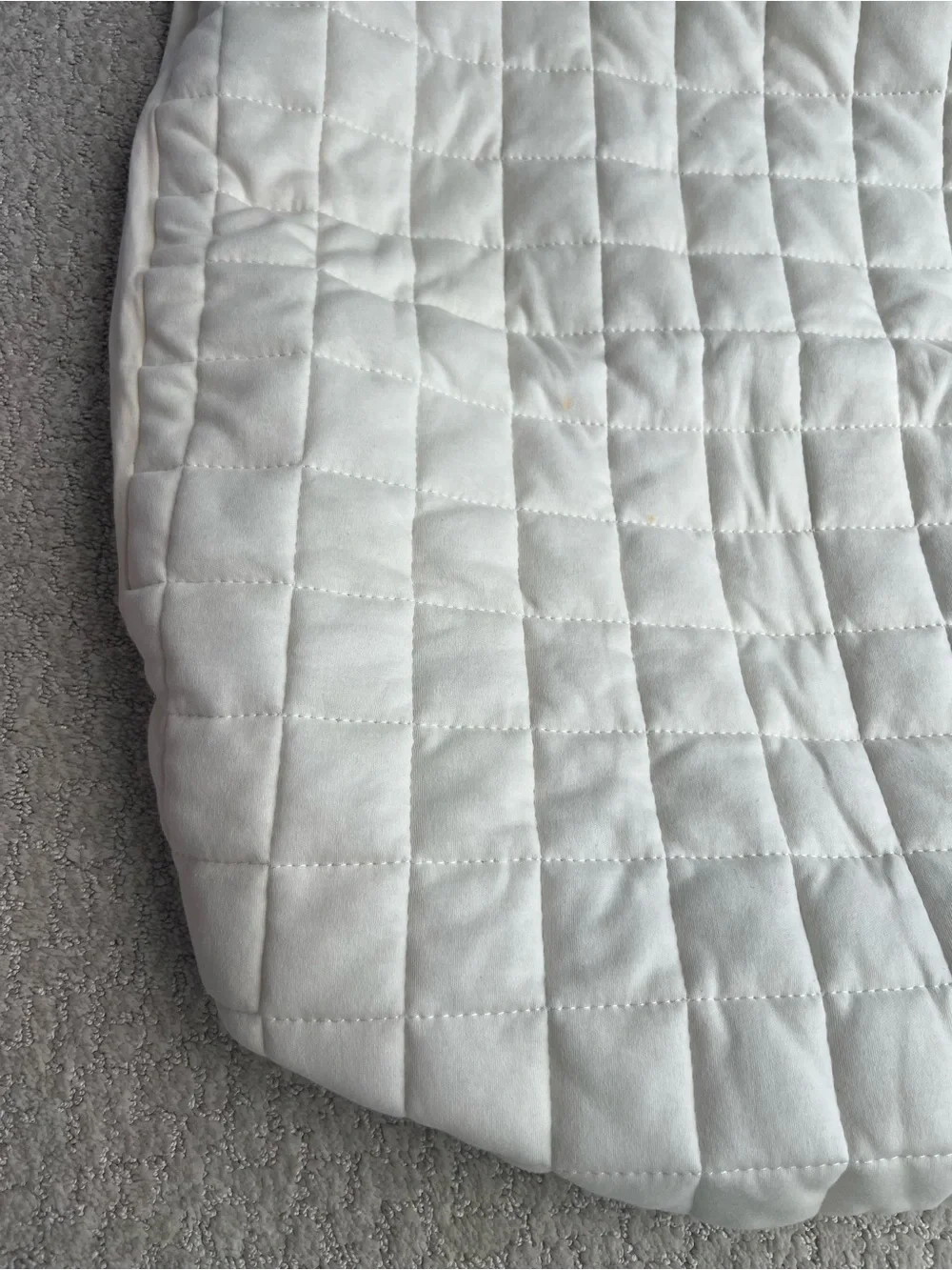 Baby crib quilted fitted mattress pad or protector in a soft ivory, 26”x39”